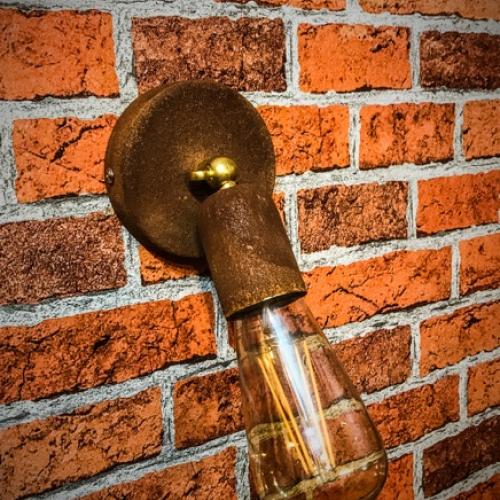 rusted metal angle wall light.